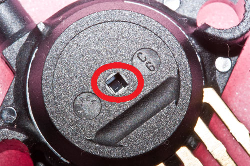Close up of square hole on case (red ring around it)