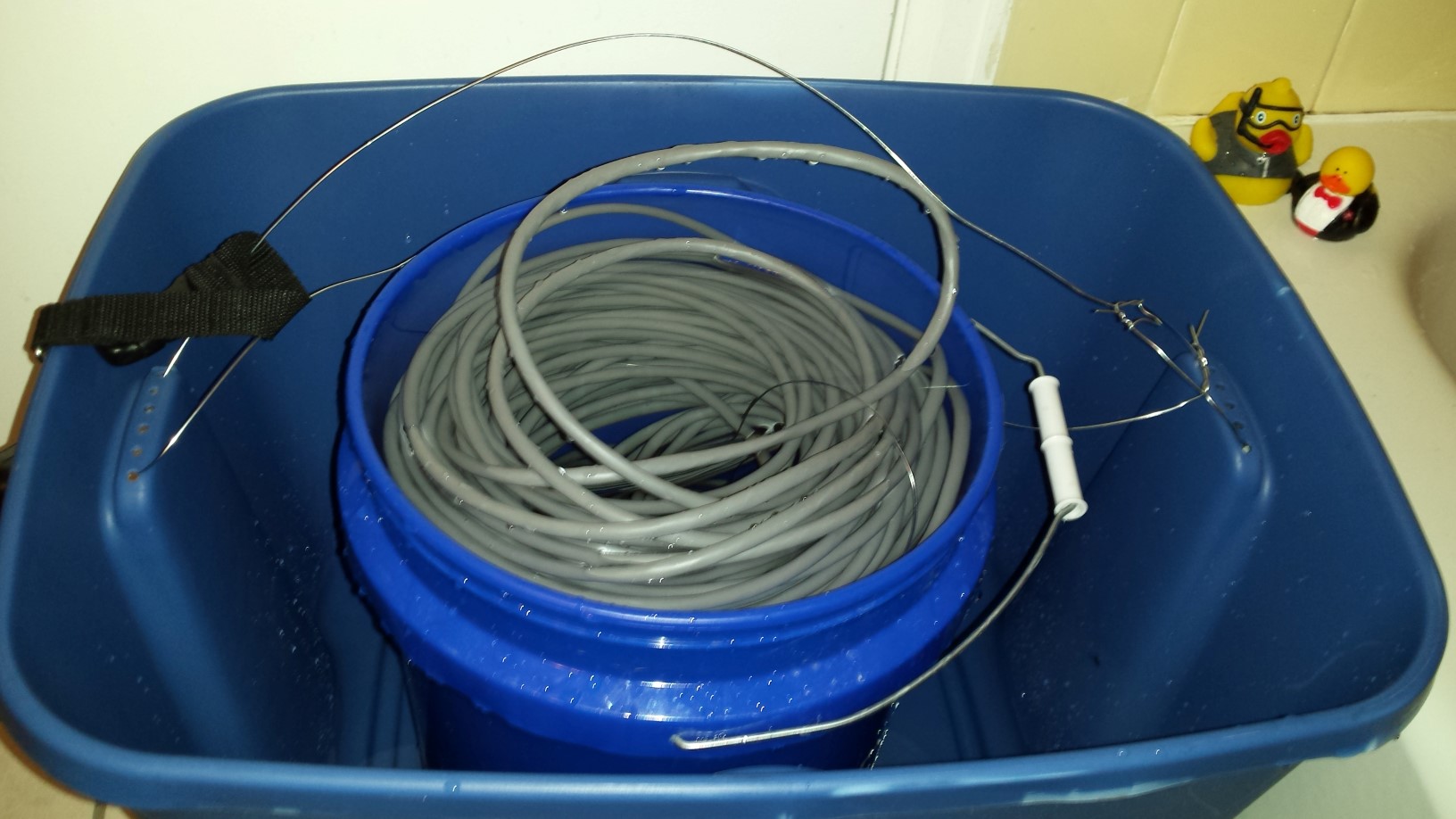 Wire placed into bucket. (best as possible)