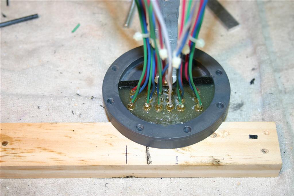 The rear bulkhead with made with a .25&quot; well in the middle to allow me to pot the female bullet connectors with slow setting epoxy. I cleaned the PVC with PVC pipe cleaner before the connectors were potted. This allowed the epoxy to bond to the PVC.