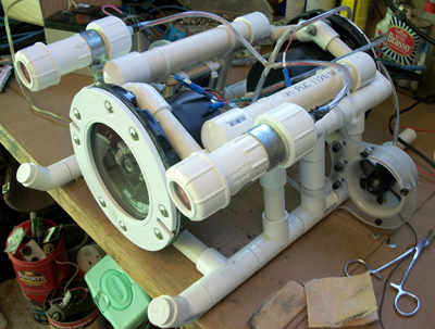 Latest and greatest attempt initial water test went well so I preceded to finish it out. I will post some video as I get it tweaked into shape New Camera and control housings, Adjusted frame style, New dive motor mount set in the center of the unit, New light housings and design.<br />Added 2 Battery packs for camera and lights to avoid voltage drop problems with both.